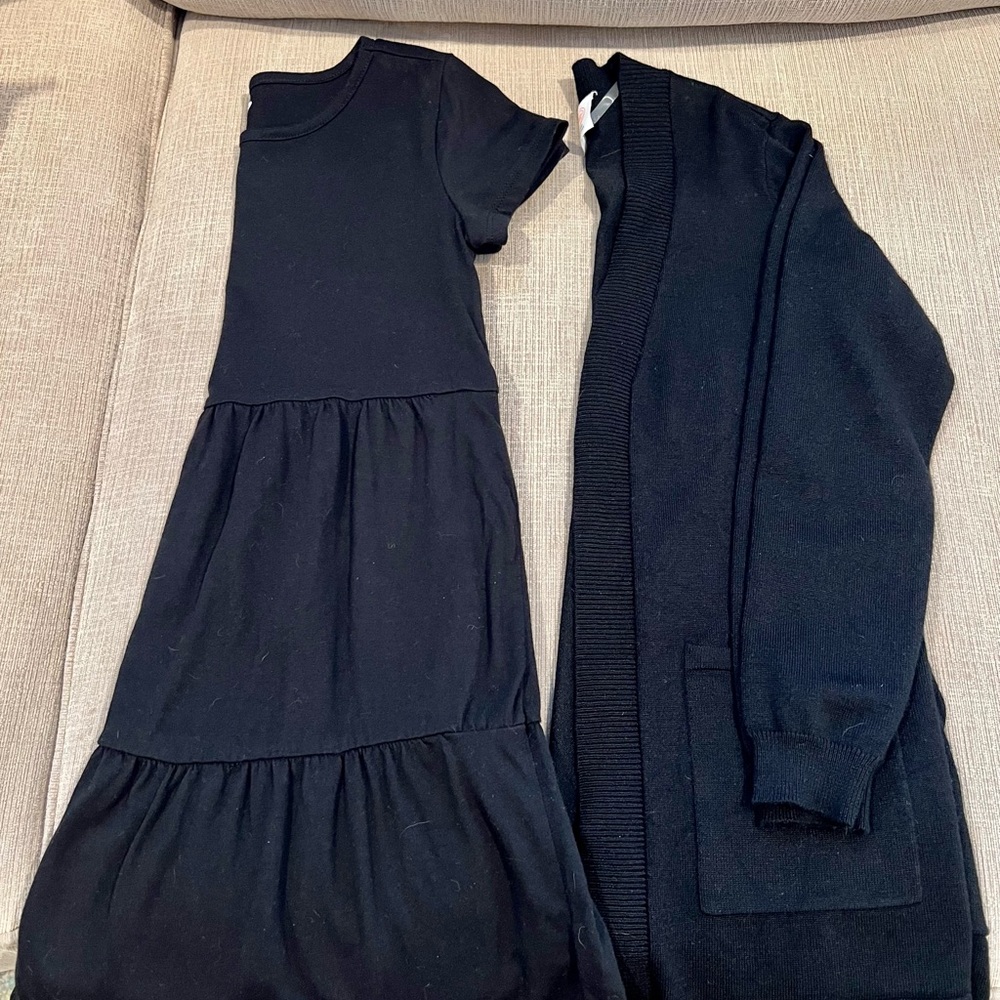 Girl’s black dress and cardigan